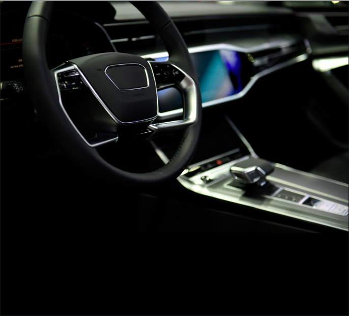 A red Lukoil racing car drifting on track with smoke effects showing dynamic motorsport action